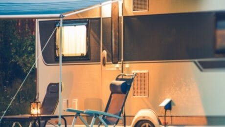 Caravan with awning extended in early evening